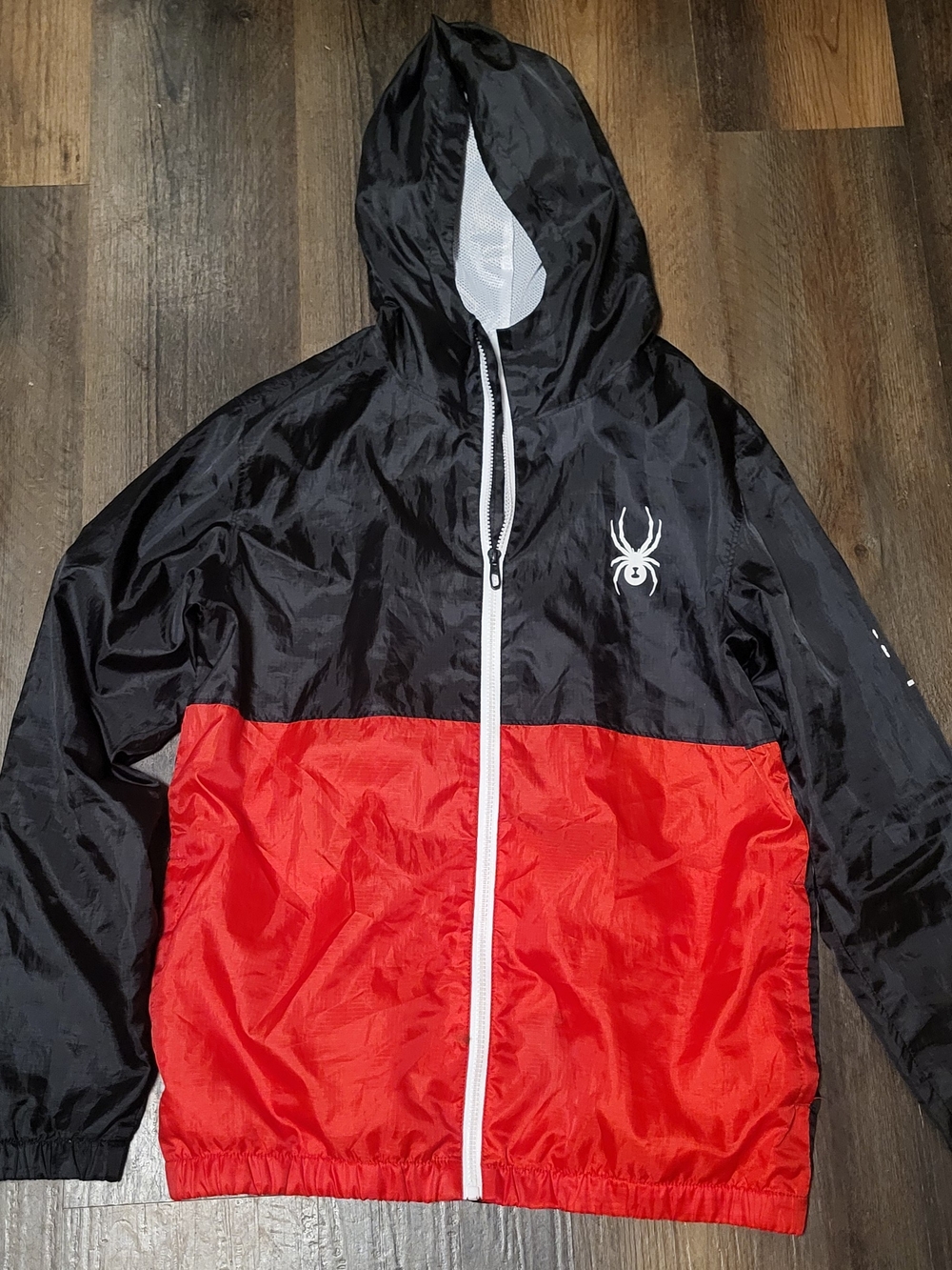 Spyder Brand Hooded Windbreaker in a red and black.